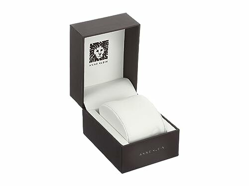 Open Anne Klein watch box with a cushion inside.