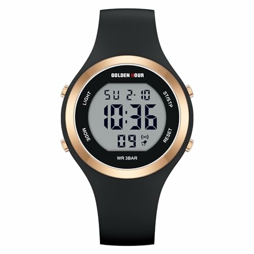 Black digital sports watch with gold accents and rubber strap, displaying time and date.