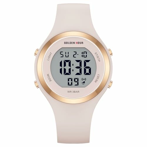 Digital watch with gold accents displaying time and date.
