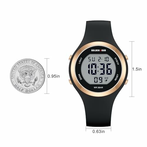 Digital watch with size comparison to a half dollar coin.