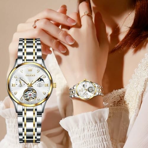 Woman wearing an elegant luxury watch with a gold and silver band.