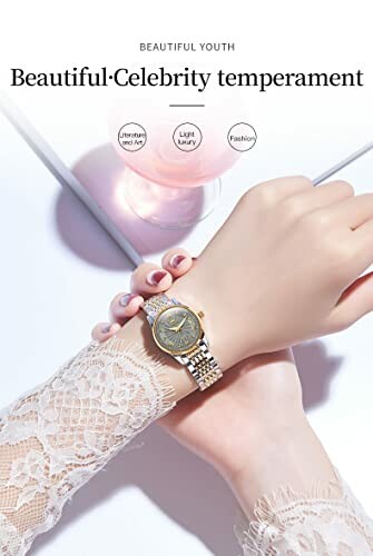 Woman's wrist with a luxury gold watch near a pink candle.