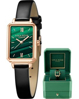 Rose gold watch with green face and black strap next to a matching green gift box.