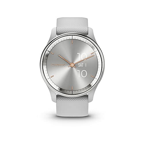 Silver Garmin smartwatch with a white band displaying time and date.