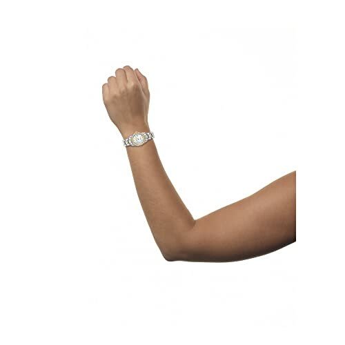 Arm with gold watch on wrist