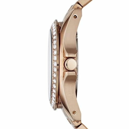 Side view of a gold watch with jeweled bezel.