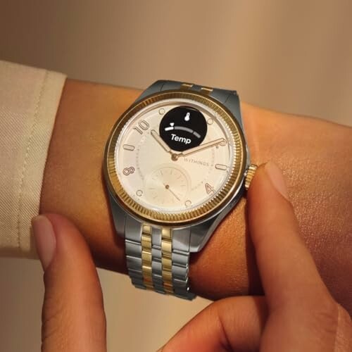 Person checking temperature on a smartwatch